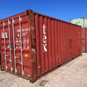 Red shipping container in storage yard